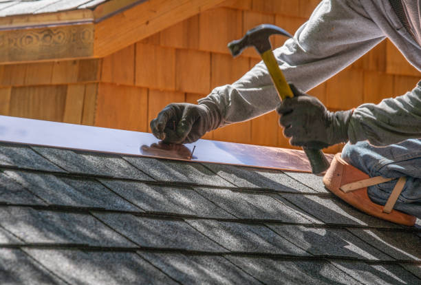 Roofer installing shingle roof.