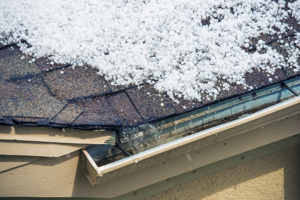 Asphalt shingle roof with hail damage.